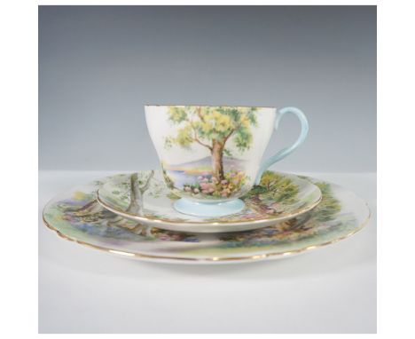 Shelley England Woodland trio set, featuring a teacup, saucer, and plate adorned with a picturesque forest scene. The design 