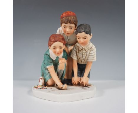 A ceramic figurine inspired by Norman Rockwell's iconic illustration Marbles Champions, originally published in The Saturday 