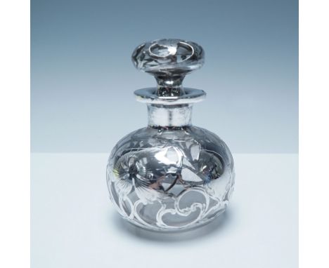 Elegant perfume bottle with intricate silver overlay detailing. The round-bodied glass vessel features a beautifully ornate f