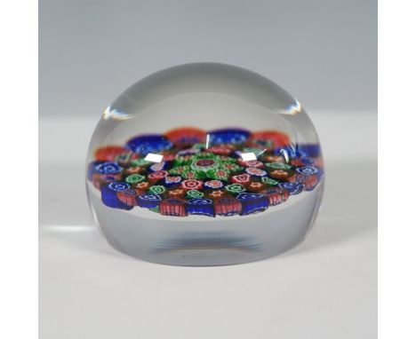 A Baccarat millefiori paperweight featuring a vibrant concentric cane design, crafted with precision using the iconic Venetia