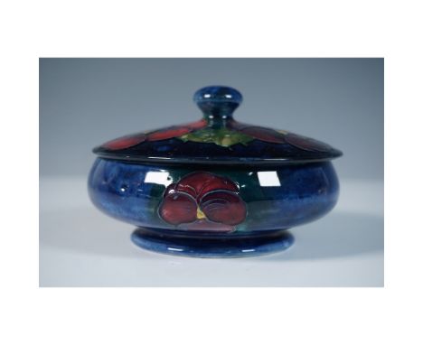 Moorcroft pottery powder bowl in the Pansy pattern, designed by William Moorcroft. This finely crafted piece showcases vibran