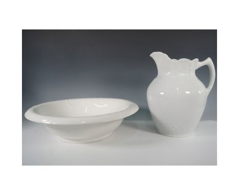 A vintage white ironstone pitcher and wash basin set, featuring a gracefully molded pitcher with a "Virginia" backstamp and a