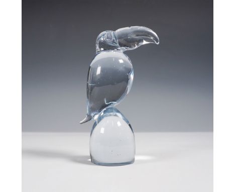 A stunning hand-blown export art glass sculpture of a toucan, featuring a sleek and modern design with a light blue tint. The