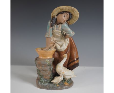 Lladro Laundry Day Gres figurine, model 01012216, depicting a young girl in rustic attire, wearing a straw hat as she leans o
