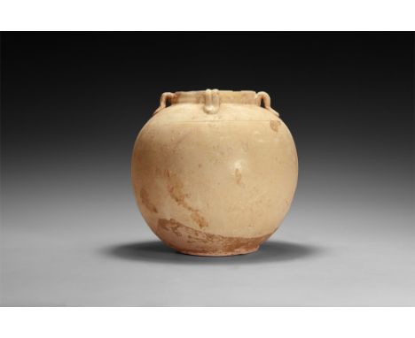 Song Dynasty, 960-1279 AD.A bulbous glazed ceramic jar with incised line below the shoulder, low rim with four loop handles t