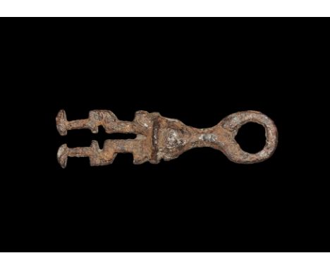 9th-11th century AD.   A sturdy iron casket key comprising an annular bow and bulbous, round-section shaft, openwork plate wi