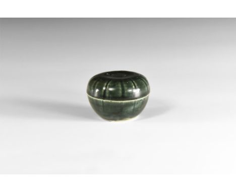14th-15th century AD.A ceramic lidded jar with dark grey pigment, radiating lines to lid and body. 112 grams total, 65mm (2 1