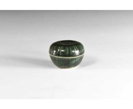 14th-15th century AD.A ceramic lidded jar with dark grey pigment, radiating lines to lid and body. 112 grams total, 65mm (2 1