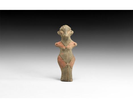 Neolithic, 6th-4th millennium BC.A ceramic figurine of a standing female with prominent nose and hair, stub arms extended, sm