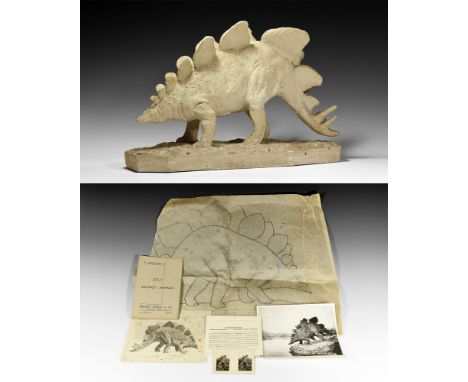 Circa 1930.   A plaster model of a Stegosaurus on a textured base with two rows of armoured flanges to the back, horned tail;