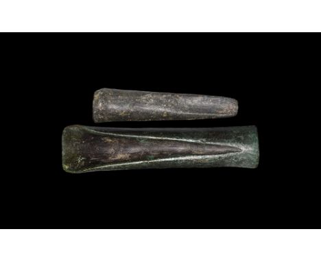 Later 2nd millennium-early 1st millennium BC.A group of two bronze socketted gouges comprising: one tubular with flared edge,