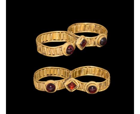 1st century AD.   A gold double ring, each hoop formed with two outer filets and a corrugated median band, two large and two 