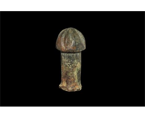 1st century BC-1st century AD.   A bronze leather punch formed as a sturdy columnar shaft and domed head with four radiating 