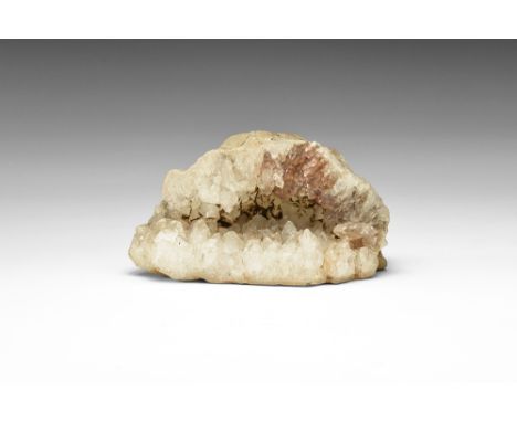 Half of a calcite-filled geode with scalenohedral crystals; in old white card tray and inked label reading: 'Khandala'. See B
