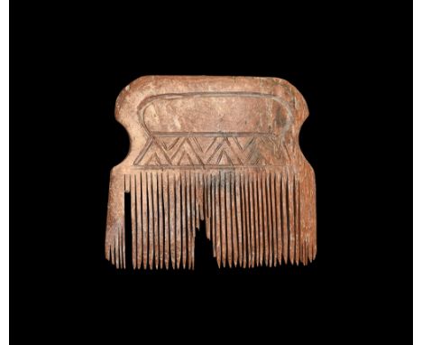 7th-10th century AD.   A bone comb with rectangular handle engraved with zig-zag pattern; fine teeth to the bottom. 22 grams,