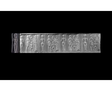 2nd millennium BC.A haematite cylinder seal with frieze of a king with a mace facing the suppliant goddess Lama, between them