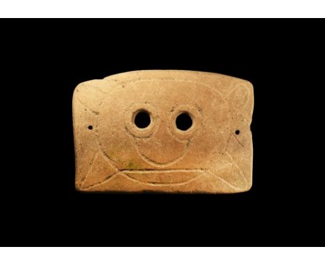 4th-3rd century BC.A rectangular-shaped slightly curved ceramic mask with two eye-holes and incised stylised facial details; 