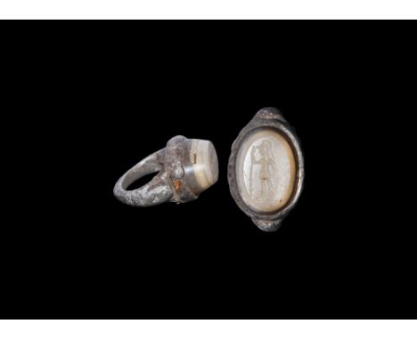 2nd-3rd century AD.A silver ring with D-section hoop expanding at the shoulders to snake's heads supporting oval bezel with i