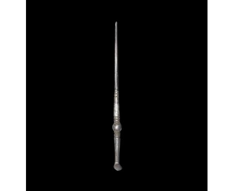 1st-2nd century AD.   A silver stylus with balustered shaft, tapering point, canted discoid erasing tool. 10 grams, 11.5cm (4