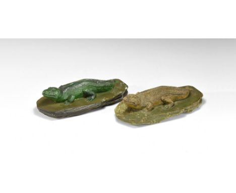 Circa 1930.   A pair of models in painted plaster, each of an extinct species of crocodile on a textured irregular base. 944 