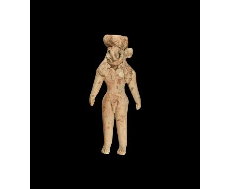 4th-3rd millennium BC.A ceramic figure of a standing male, cap to top of head, large hooked nose with pierced holes for eyes,