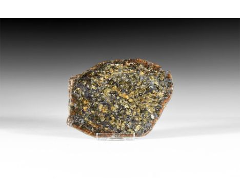 Discovered 1967.   A polished section slice of the meteorite, the cut surfaces showing the distinctive crystallisation and th