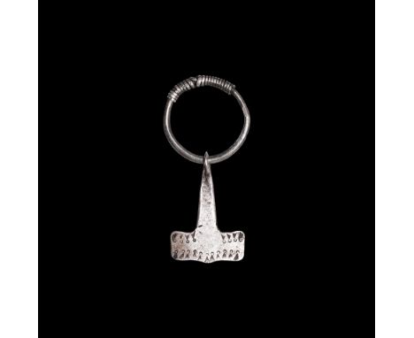 9th-10th century AD.   A silver Mjolnir, or Thor's Hammer, with square-section shank, broad pentagonal head, bulb finial with