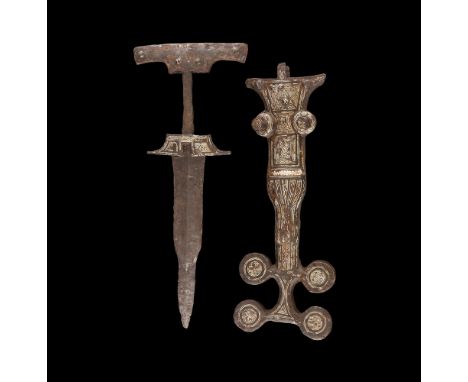 4th-3rd century BC.An iron dagger and associated scabbard; the dagger with carp's tongue blade, flared lower guard, rounded g