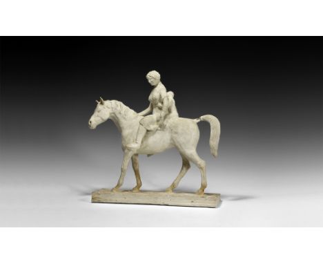 Circa 1930.   A plaster model of a horse advancing with female rider and child; the rider with knee-length tunic, shoes and n