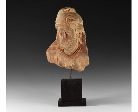 1st-3rd century AD.   A schist head of a prince with beard, elongated ears, turban to head with knotted sash to the brow; mou