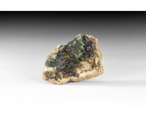 An unusual group of prismatic azurite crystals on matrix from the French Alps; in white card tray with adhesive tape label re