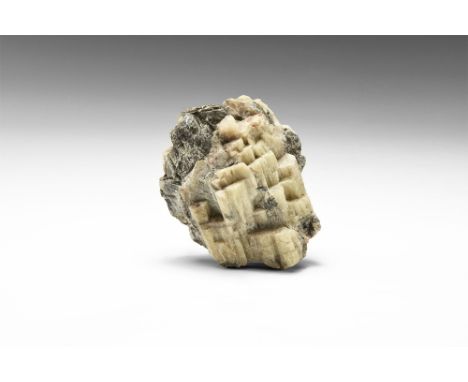 A specimen comprising numerous parallel growth crystals of lanarkite; in white card tray with adhesive tape label reading: '3