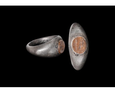 2nd century AD.A D-section silver keeled hoop with angled shoulders, discoid agate insert with intaglio motif of winged Victo
