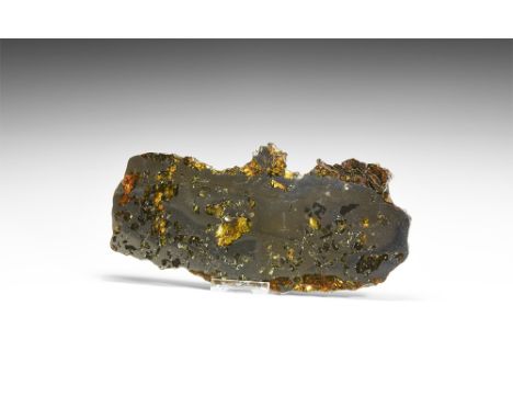 Discovered 1967.   A polished section slice of the meteorite, the cut surfaces showing the distinctive crystallisation and th