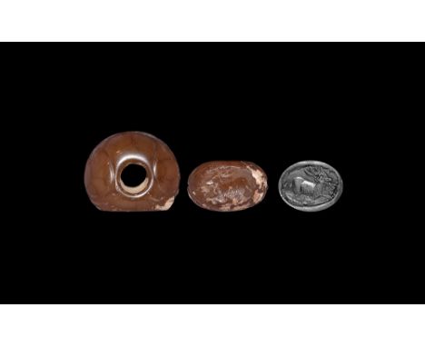 3rd-7th century AD.   A D-shaped carnelian stamp seal with panelled body; underside with intaglio advancing stag. See Gyselen