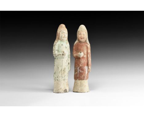 Tang Dynasty, 618-906 AD.A pair of ceramic soldiers wearing long robes to feet, one in red, the other green, cap to head, rig