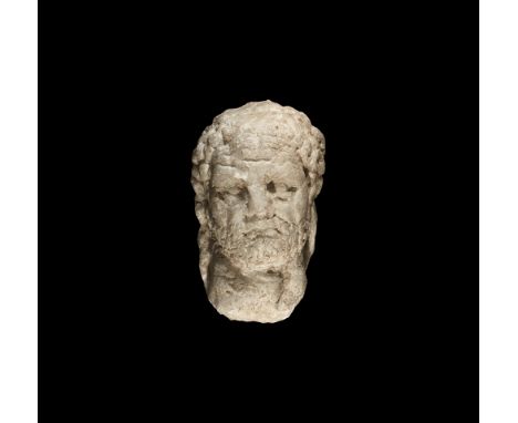 198-217 AD.   A marble bust of the emperor Caracalla with bands of curly hair and short beard, strong muscular neck; to the b