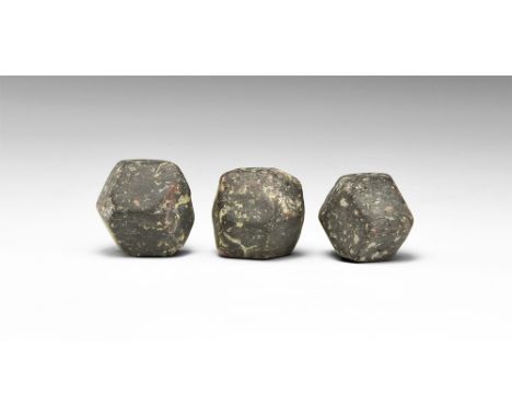 A group of three dodecahedral garnet crystals, probably almandine; in old white card tray. See Bonewitz, Dr. Ronald Louis, Ro