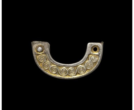 6th century AD.   A silver-gilt scabbard chape, c-shaped in section, with recessed panel to the forward edge and reserved run