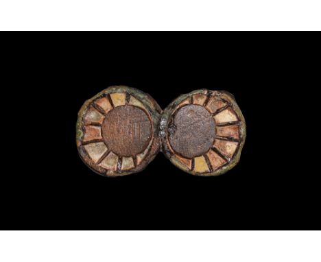 1st century BC-1st century AD.   A bronze strap slide fitting comprising two conjoined bronze discs with pierced pugs to the 