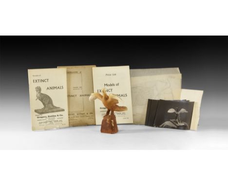 Circa 1930.   A master model in surface-treated plaster of an archaeopteryx with wings spread and head turned; two separate e