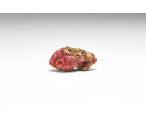 A specimen of ruby from the recently discovered deposit (1987) at Luc Yen, Vietnam; in white card tray. See Bonewitz, Dr. Ron