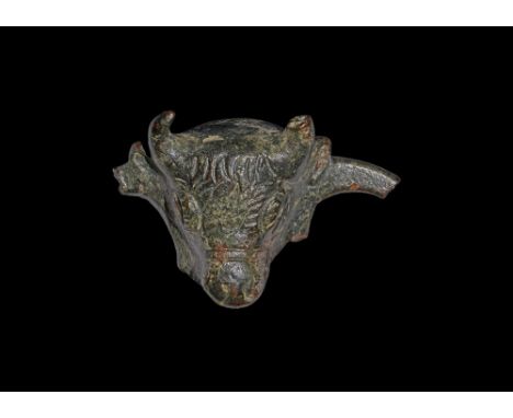 1st century BC-1st century AD. A hollow-formed bronze bull-head mount with strap across the muzzle, fragment of a loop to eac