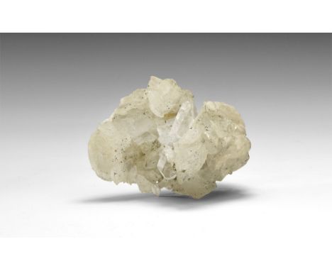A specimen comprised of a number of crystals of white baryte and yellowish siderite with accessory quartz and minor inclusion