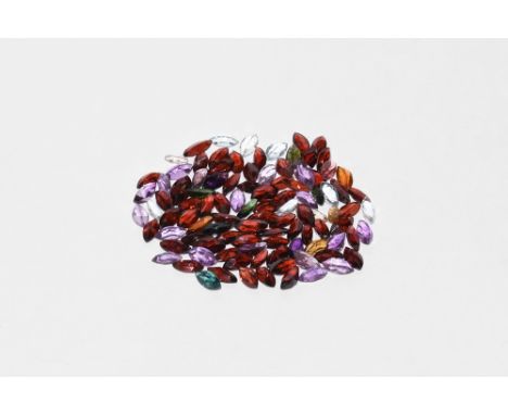 A group of one hundred marquise-cut garnets, citrine, crystal, amethyst and other gem stones. 14.42 grams total, 5-8mm (1/4")