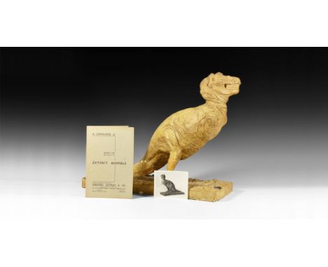 Circa 1930.   A master model in surface-treated plaster of a Tyrannosaurus rex on a textured rectangular base, with forelimbs