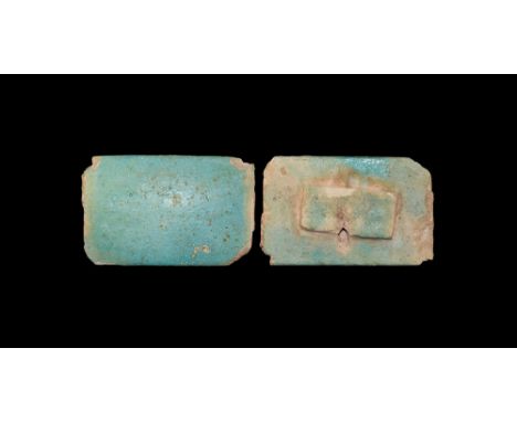 Old Kingdom, 3rd Dynasty, 2686-2181 BC.A blue glazed composite rectangular tile with small lug to the back. 25 grams, 60mm (2