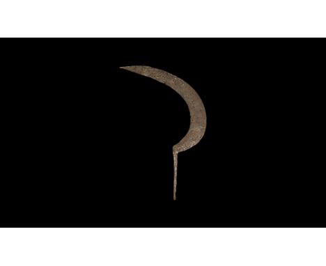 14th-15th century AD.An iron sickle blade with curved profile, edge to the inner face, rectangular-section tang with peened f