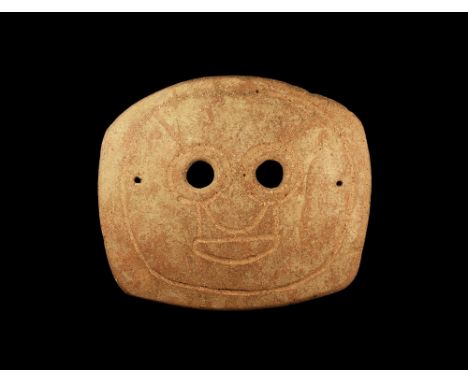 4th-3rd century BC.A large rectangular-shaped slightly curved ceramic mask with two eye-holes and incised stylised facial det