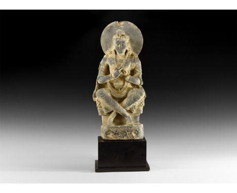 2nd-3rd century AD.A schist figure of the bodhisattva Maitreya seated in the European style on a throne with legs crossed at 